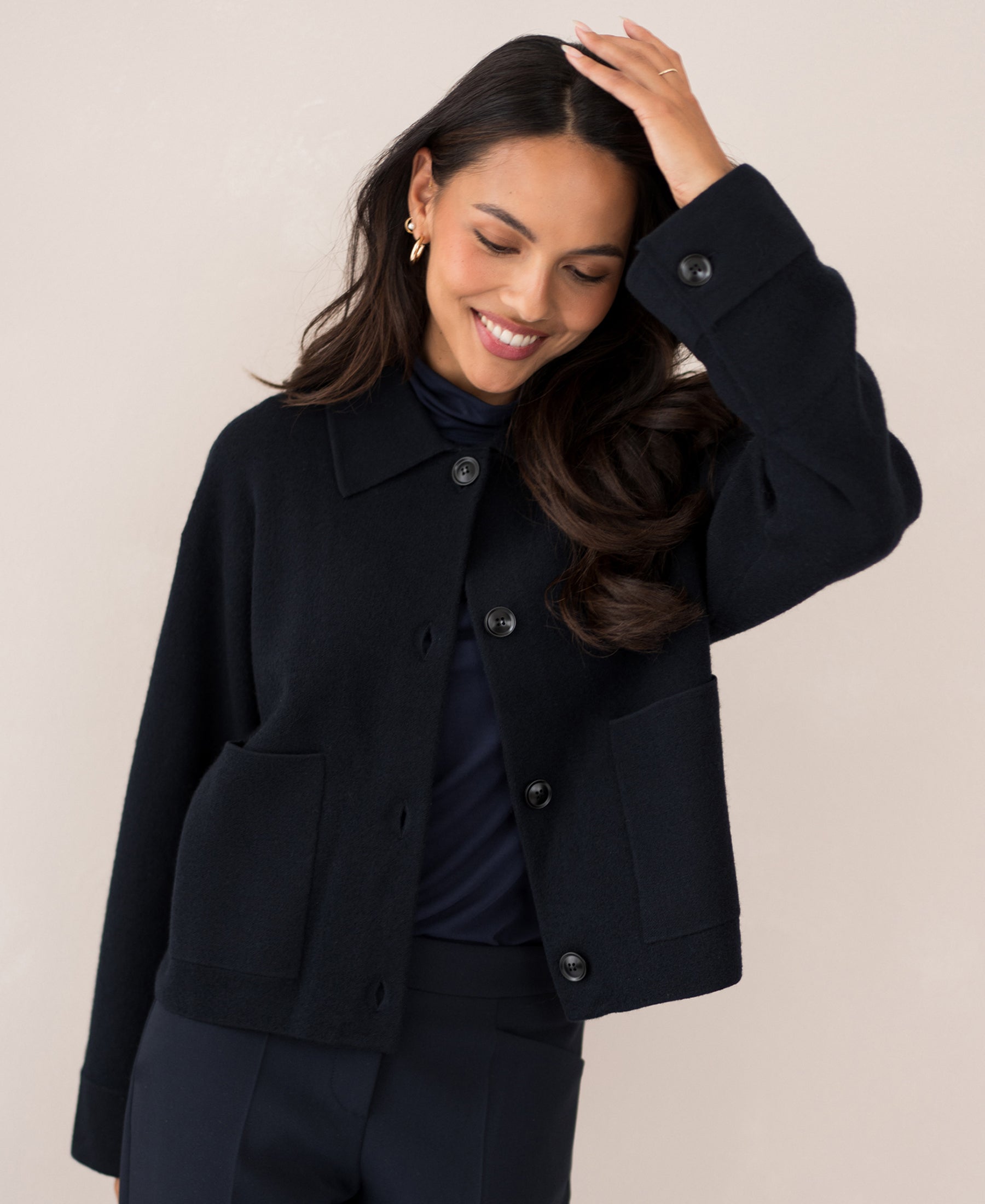 Navy blue wool blazer LA FAYE by PLEIN PUBLIQUE on a light background.