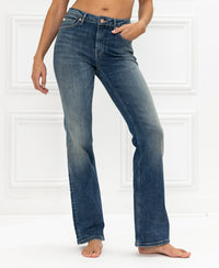 Blue vintage flared jeans in a classic style, displayed against a white background.
