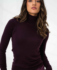 Aubergine Merino wool turtleneck sweater, shown against a plain background.