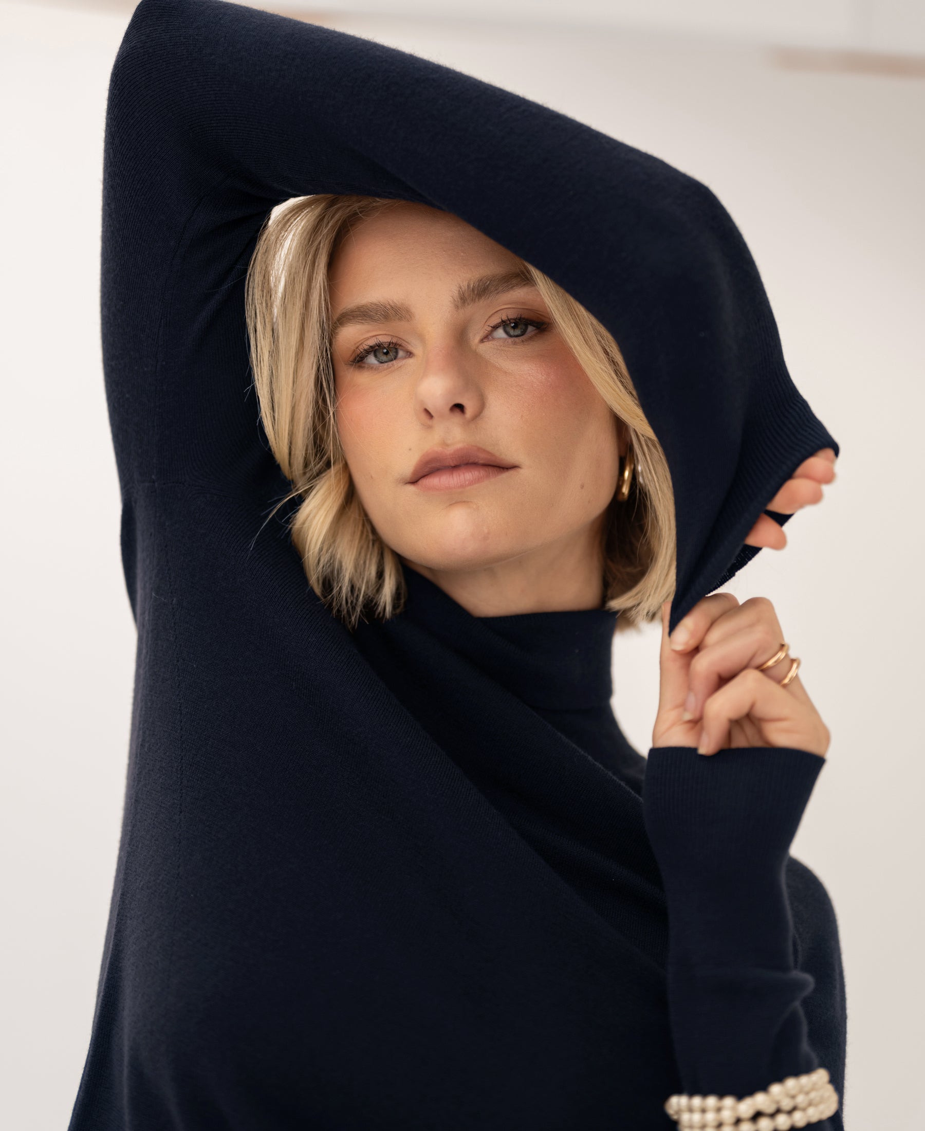 Navy blue merino wool turtleneck sweater by PLEIN PUBLIQUE, front view.