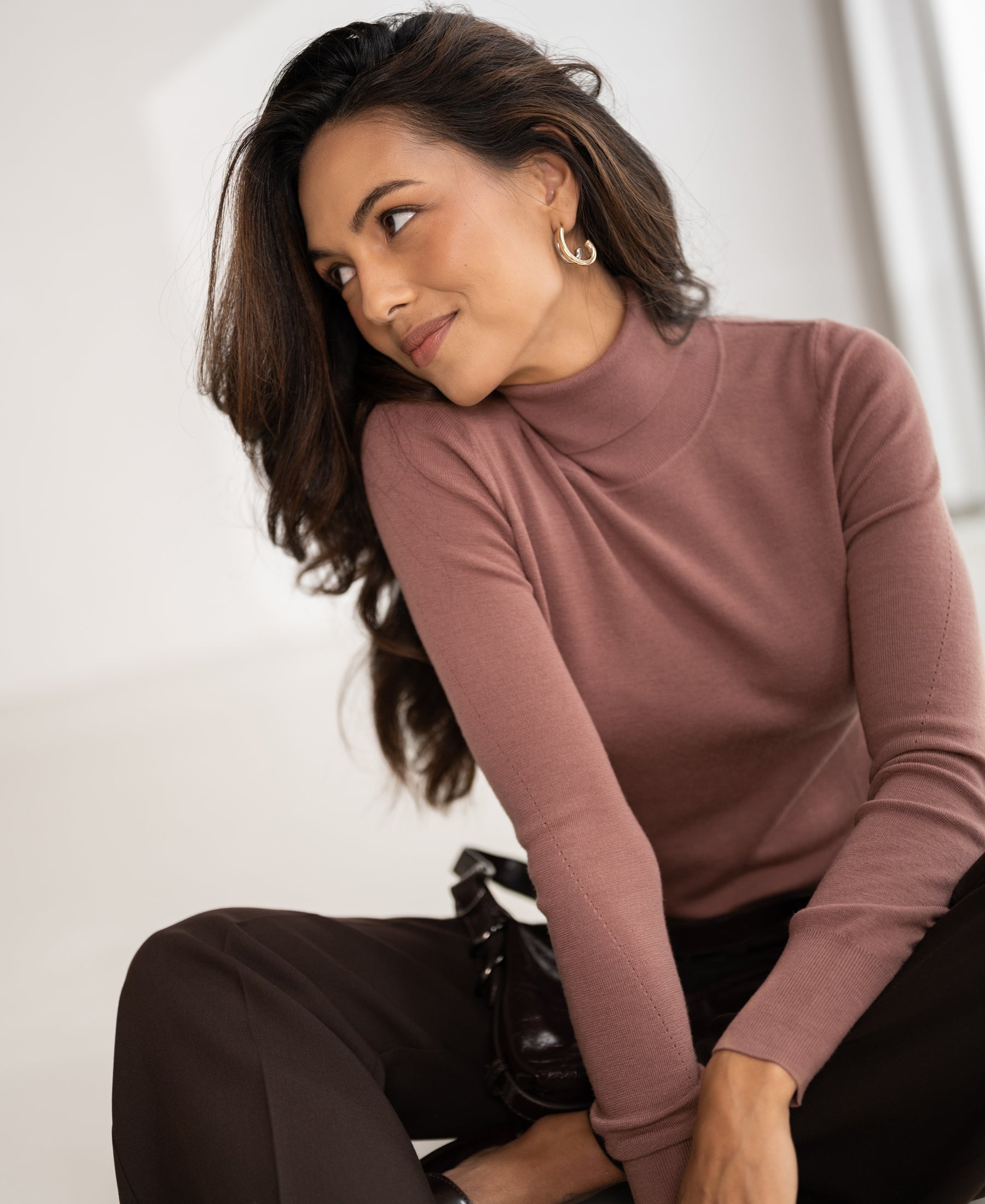 Dusty pink merino wool turtleneck sweater by PLEIN PUBLIQUE, front view.