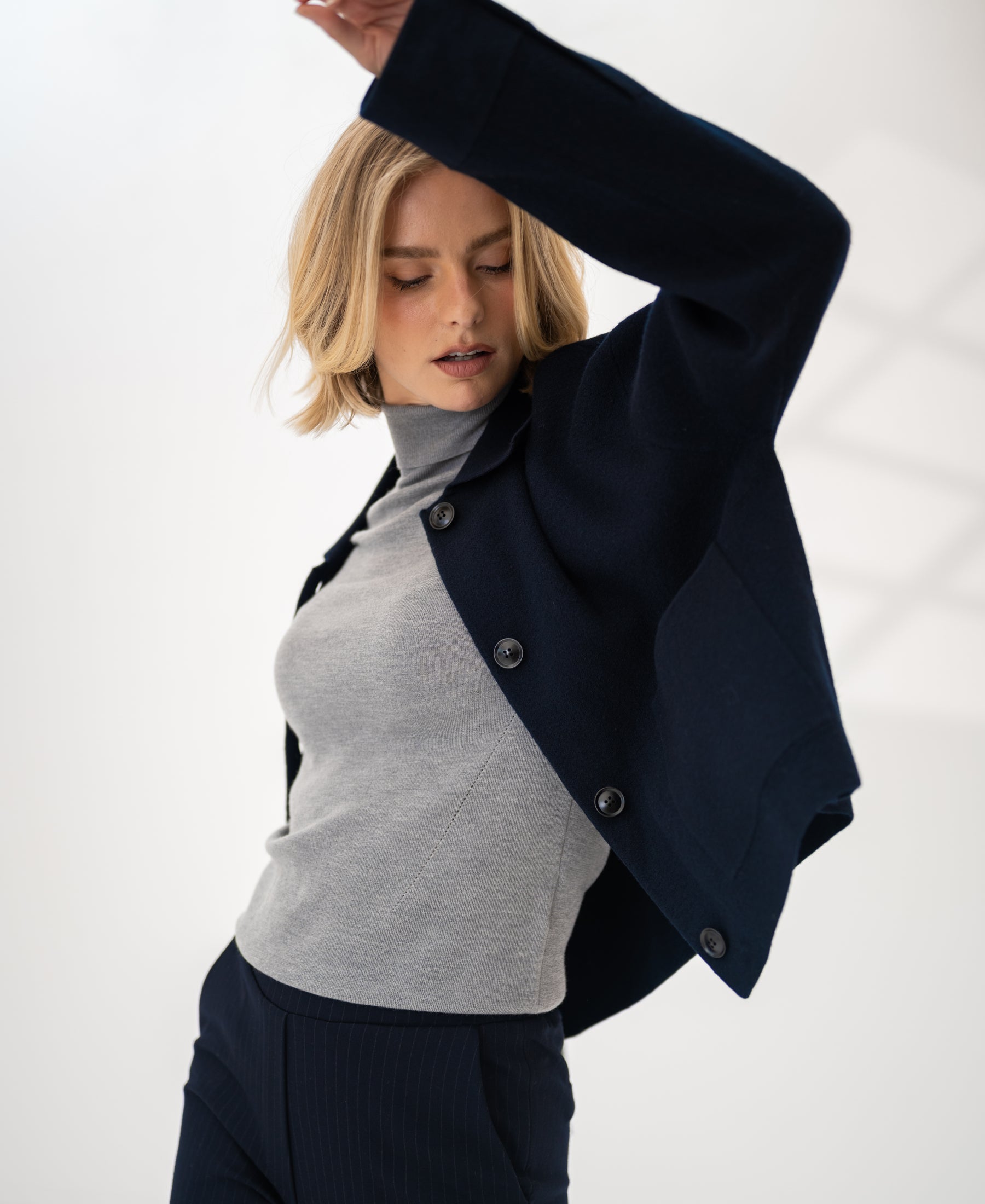 Dark blue wool blazer LA FAYE by PLEIN PUBLIQUE shown against a light background.