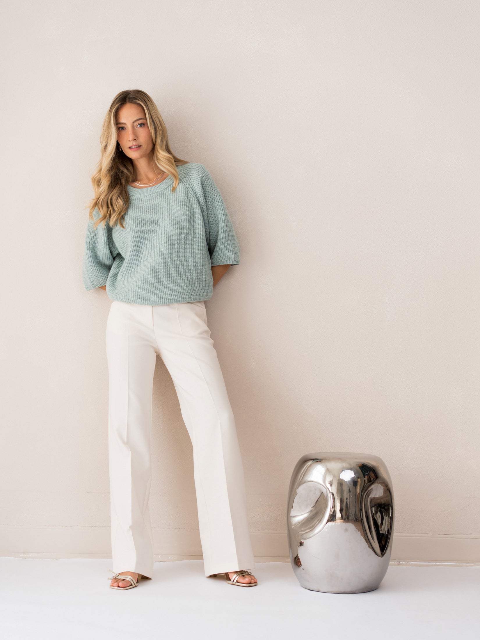 Light green PLEIN PUBLIQUE sweater called 'The Raspberry' shown on a woman, front view.