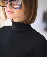 Black turtleneck sweater, front view.