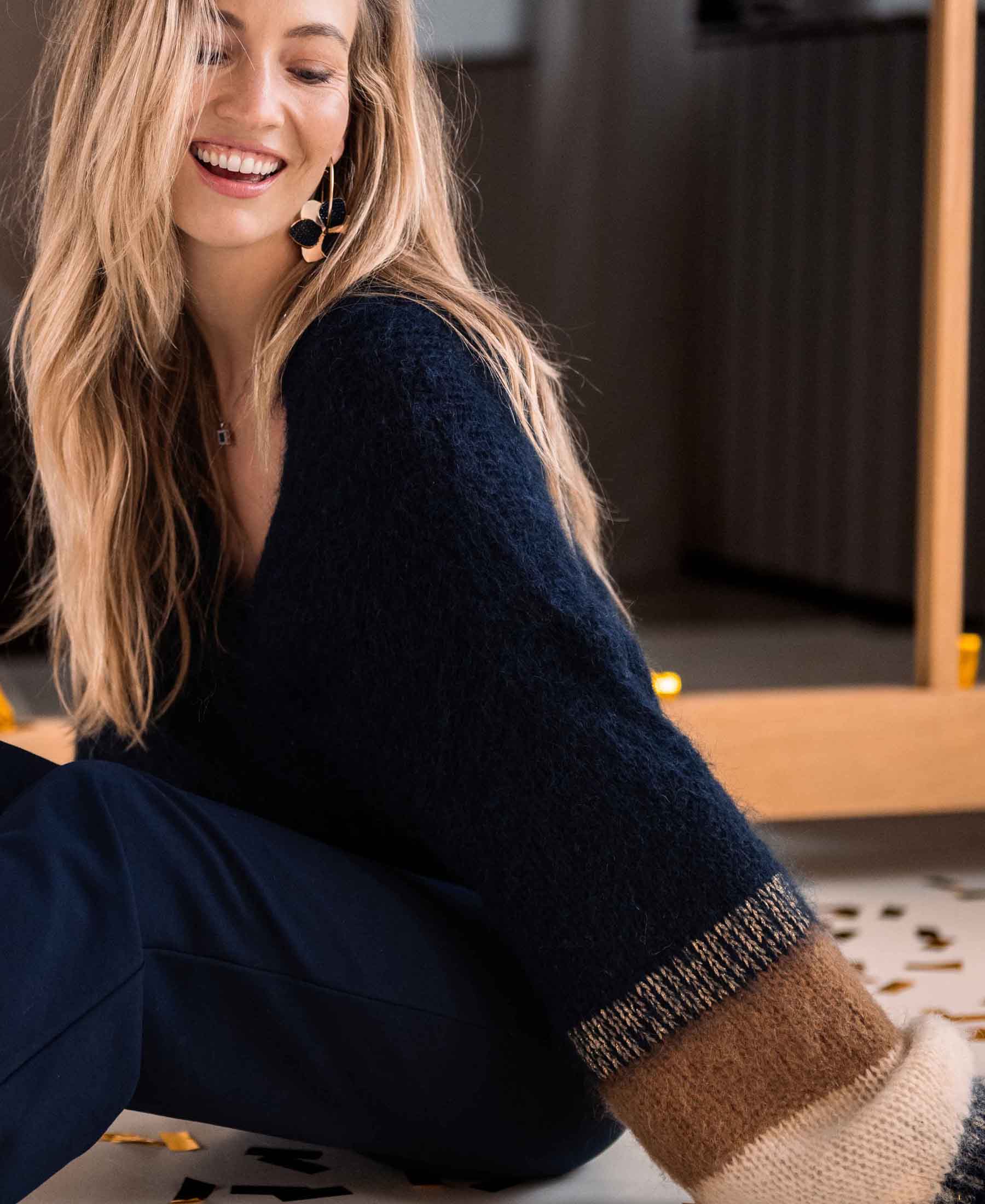 Fluffy navy striped vest in a dark blue shade, shown from the front.