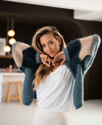 Oversized fluffy vest in light green by PLEIN PUBLIQUE, shown on model.