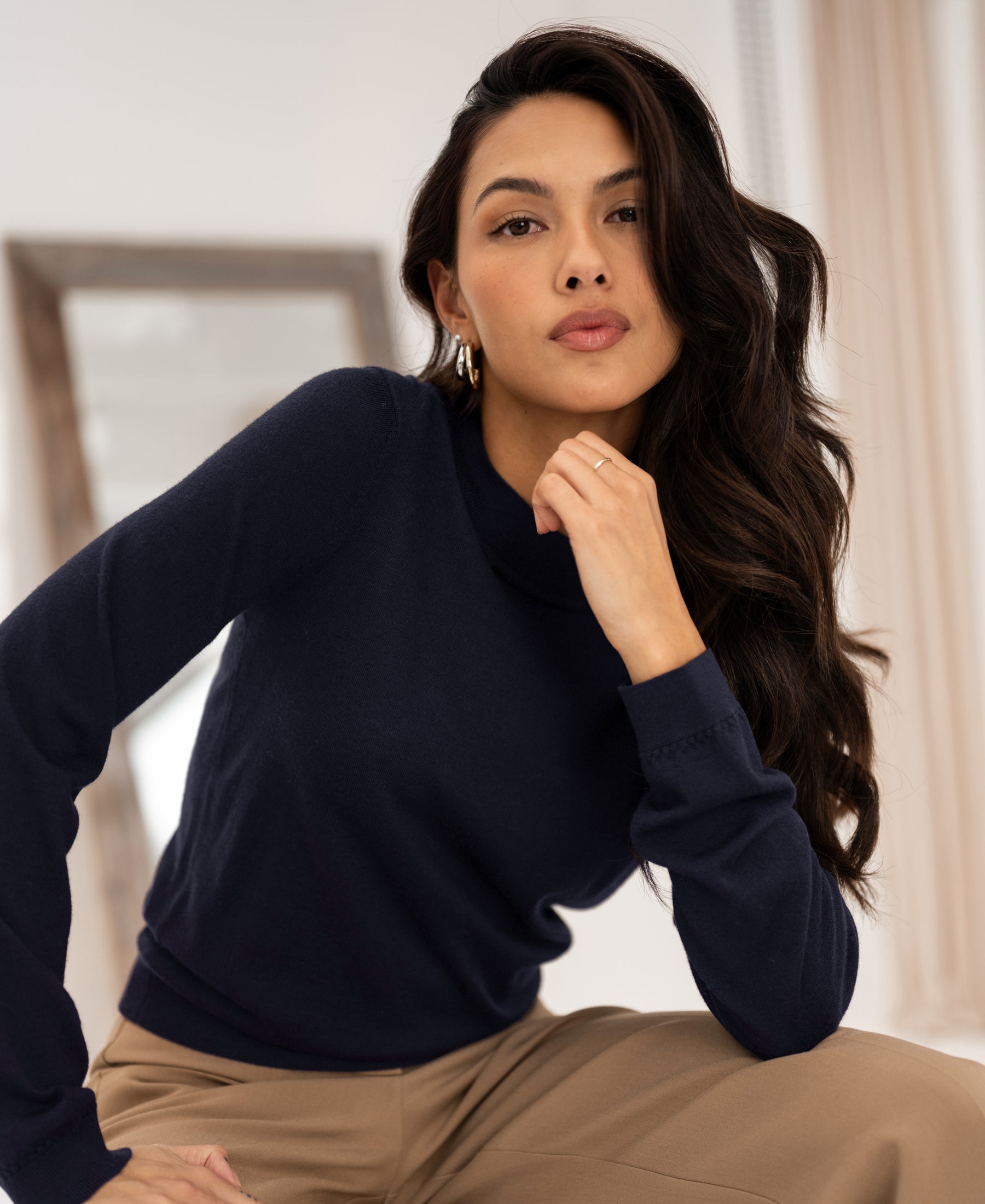 Navy blue PLEIN PUBLIQUE LA GIGI merino wool sweater shown indoors in front of a mirror.