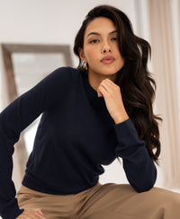Navy blue PLEIN PUBLIQUE LA GIGI merino wool sweater shown indoors in front of a mirror.