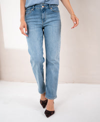 Light stone-washed cropped jeans made of denim, shown from the waist down, upper body out of frame.