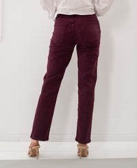 Back view of person wearing wine-colored cropped jeans.
