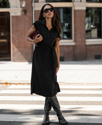 Black PLEIN PUBLIQUE Travel polo dress INES in black, shown at a crosswalk.