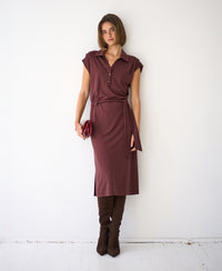Brown Travel polo dress INES by PLEIN PUBLIQUE, shown on model standing against a white wall.