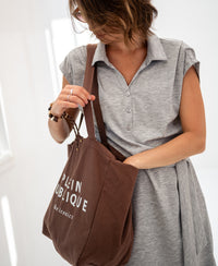 Grey melange Travel polo dress by PLEIN PUBLIQUE shown in bright natural light.