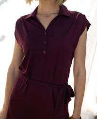 Travel polo dress in wine color with buttons and a matching fabric waist tie.