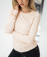 Woman wearing the Luxe long sleeve T-shirt in blush by PLEIN PUBLIQUE.