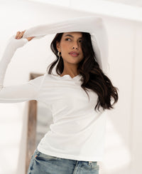 Ivory long sleeve Luxe T-shirt by PLEIN PUBLIQUE, shown in a bright room.