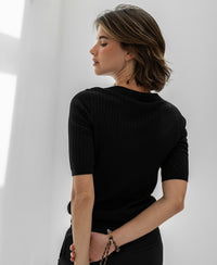 Tencel silk polo shirt LE JASMIN Black by PLEIN PUBLIQUE shown in soft light.