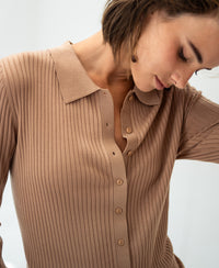 Tencel-silk ribbed cardigan in warm sand, shown on model against a light background.