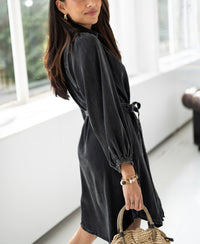 Charcoal Tencel blouse dress displayed by large windows.