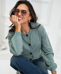 Mist green PLEIN PUBLIQUE round neck cardigan LA LEA shown indoors.