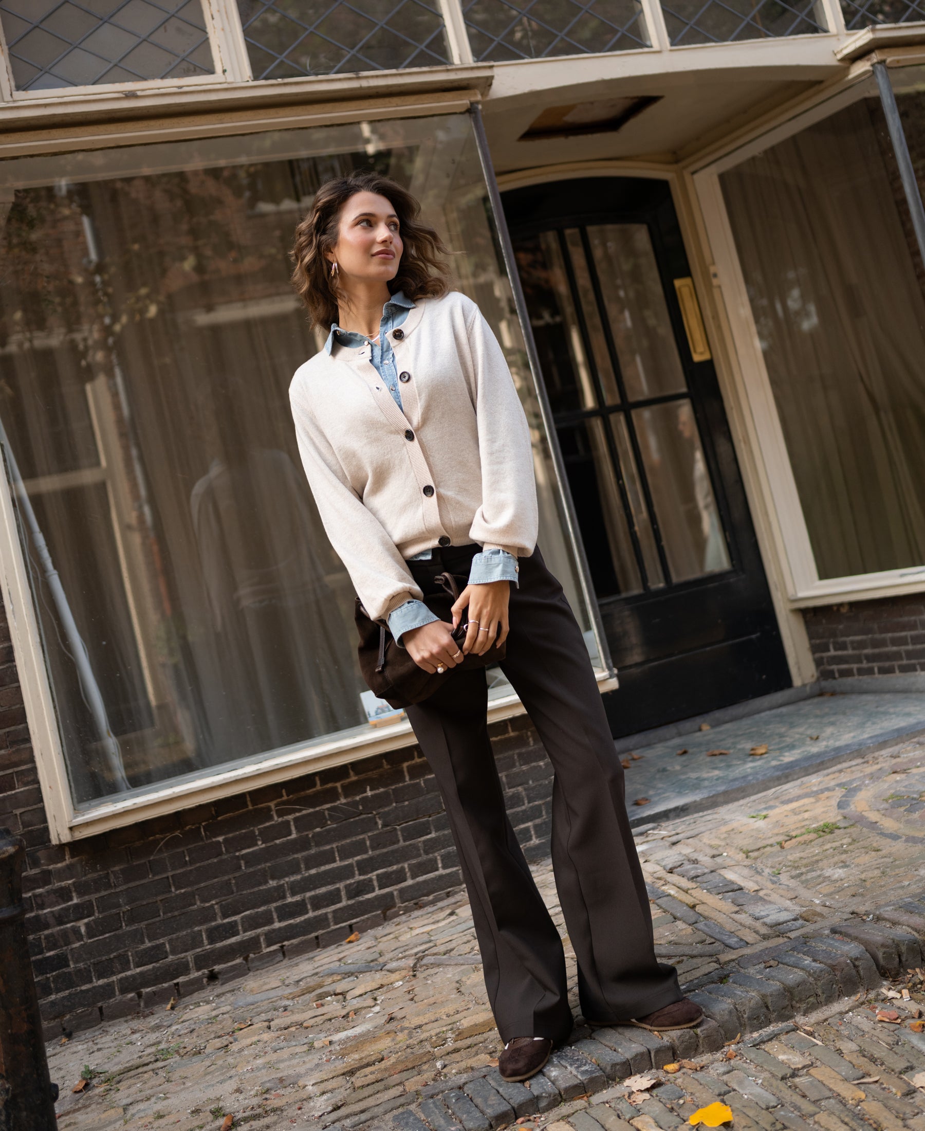 Light sand round-neck vest by PLEIN PUBLIQUE, shown on a woman outdoors.