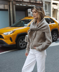 PLEIN PUBLIQUE mohair vest in sand color, shown outdoors; size advice available.