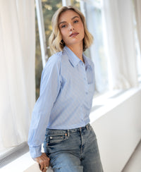 Light blue, white, and navy striped blouse from Plein Publique La Loire worn by a woman with short blonde hair.