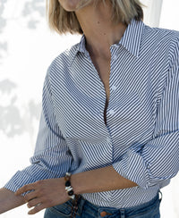 White and black striped LA LOIRE blouse by PLEIN PUBLIQUE with rolled sleeves.