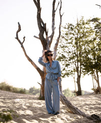 Bleached Tencel jeans in a classic cut, shown in an outdoor setting.