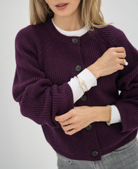 Merino wool vest in Cassis color, shown worn by a model.