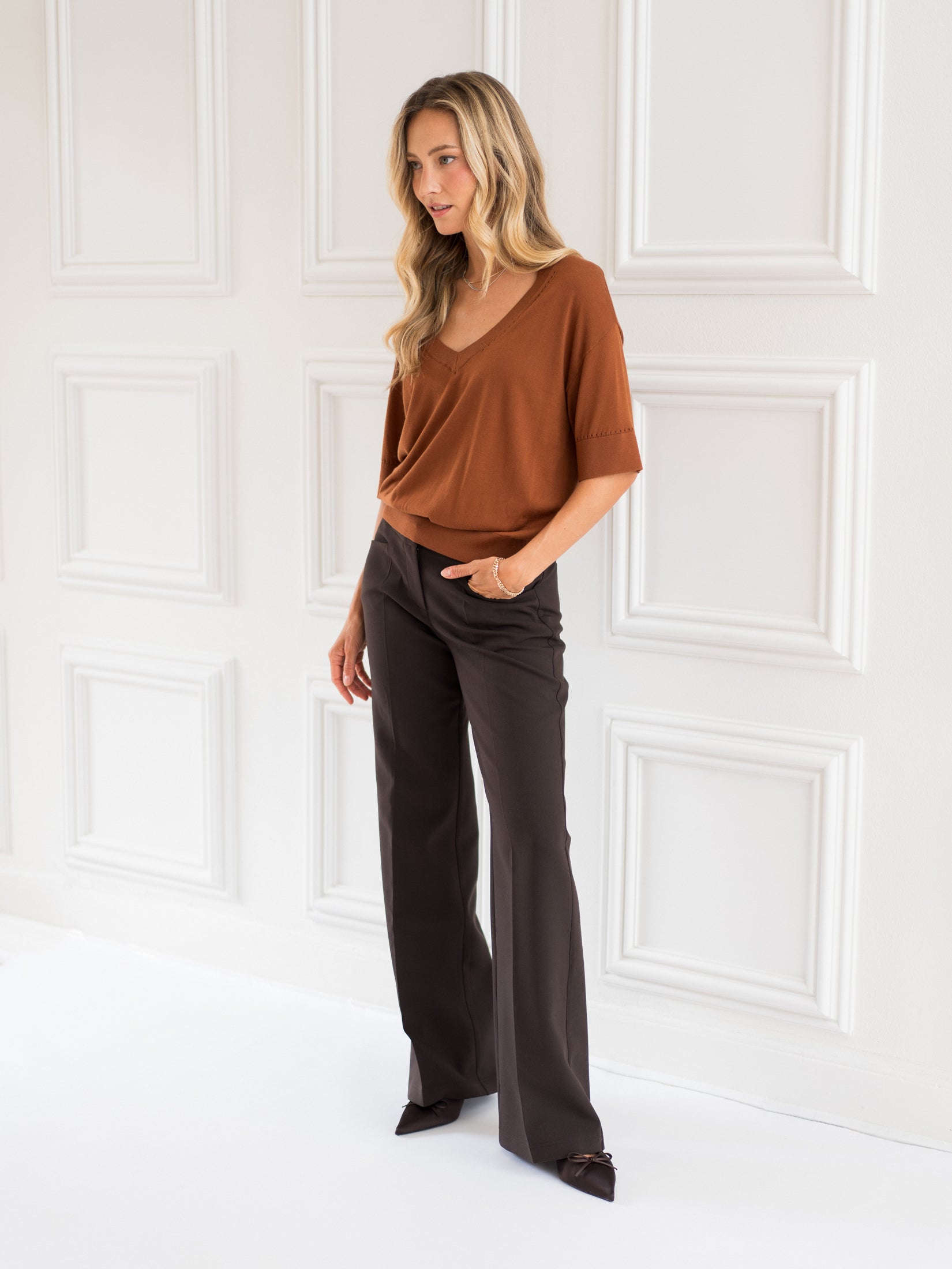 Woman wearing the Havana silk top by PLEIN PUBLIQUE, shown from the front.
