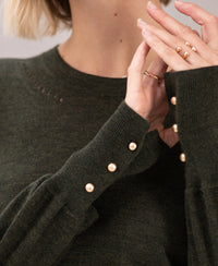 Dark green Merino wool LA MARIS sweater by PLEIN PUBLIQUE with gold details.