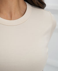 Close-up of the luxe and soft yellow LA MASSY T-shirt by PLEIN PUBLIQUE, showing neckline and shoulder detail.