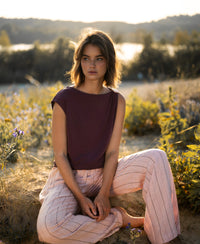 Wine-colored LA MAYA top with a clasp by PLEIN PUBLIQUE, shown worn outdoors.