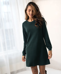 Dark green Merino wool dress by PLEIN PUBLIQUE, LA MIMI style, shown indoors.