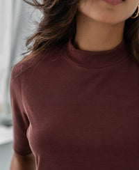 Maroon mock-neck ribbed short-sleeve top made of cotton blend, shown from the front.