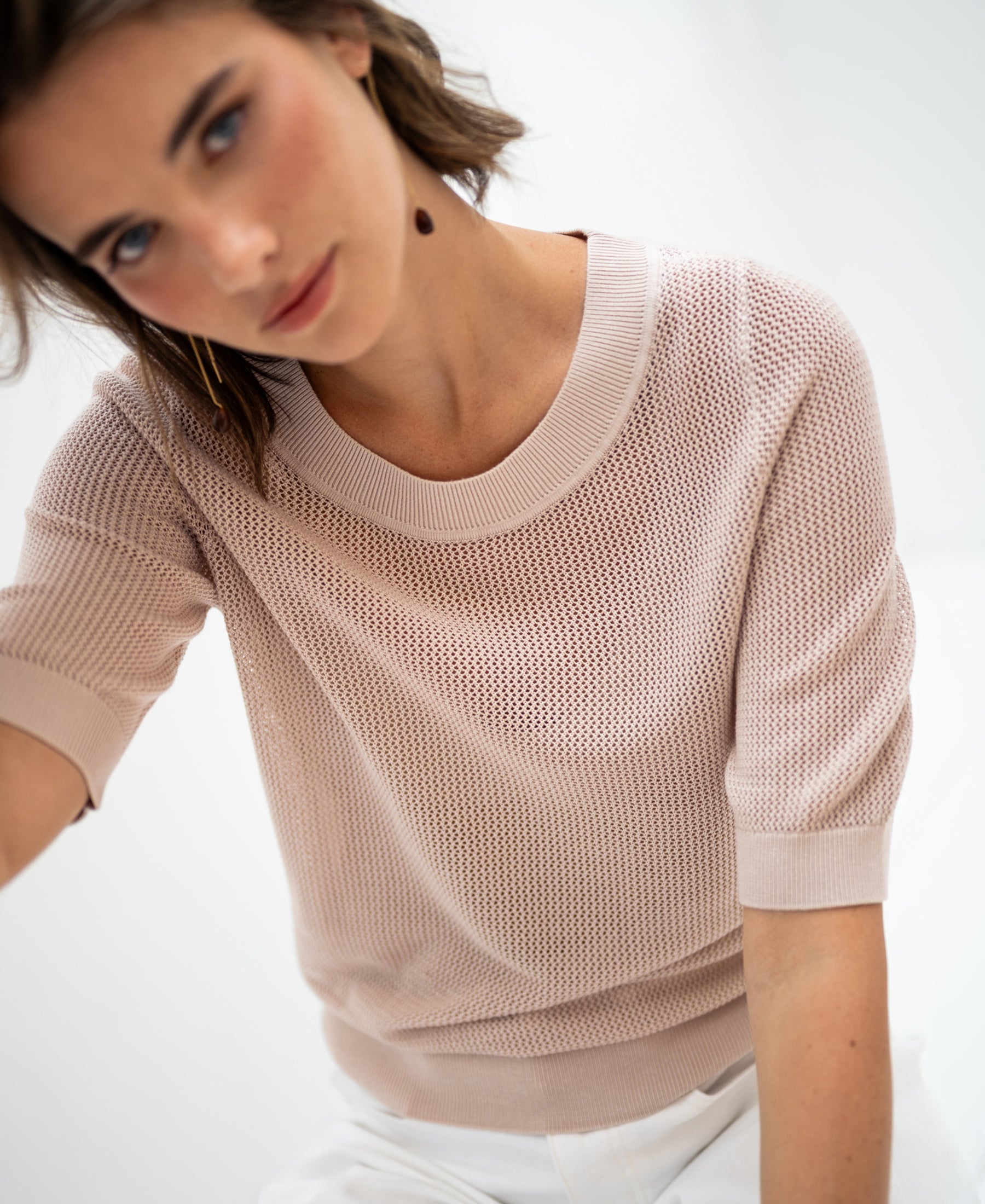 Light sand mesh sweater with silk by PLEIN PUBLIQUE, shown against a blurred background.