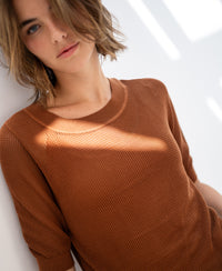 Mesh sweater LE NANCY with silk in Havana color by PLEIN PUBLIQUE, shown in sunlight against a white wall.