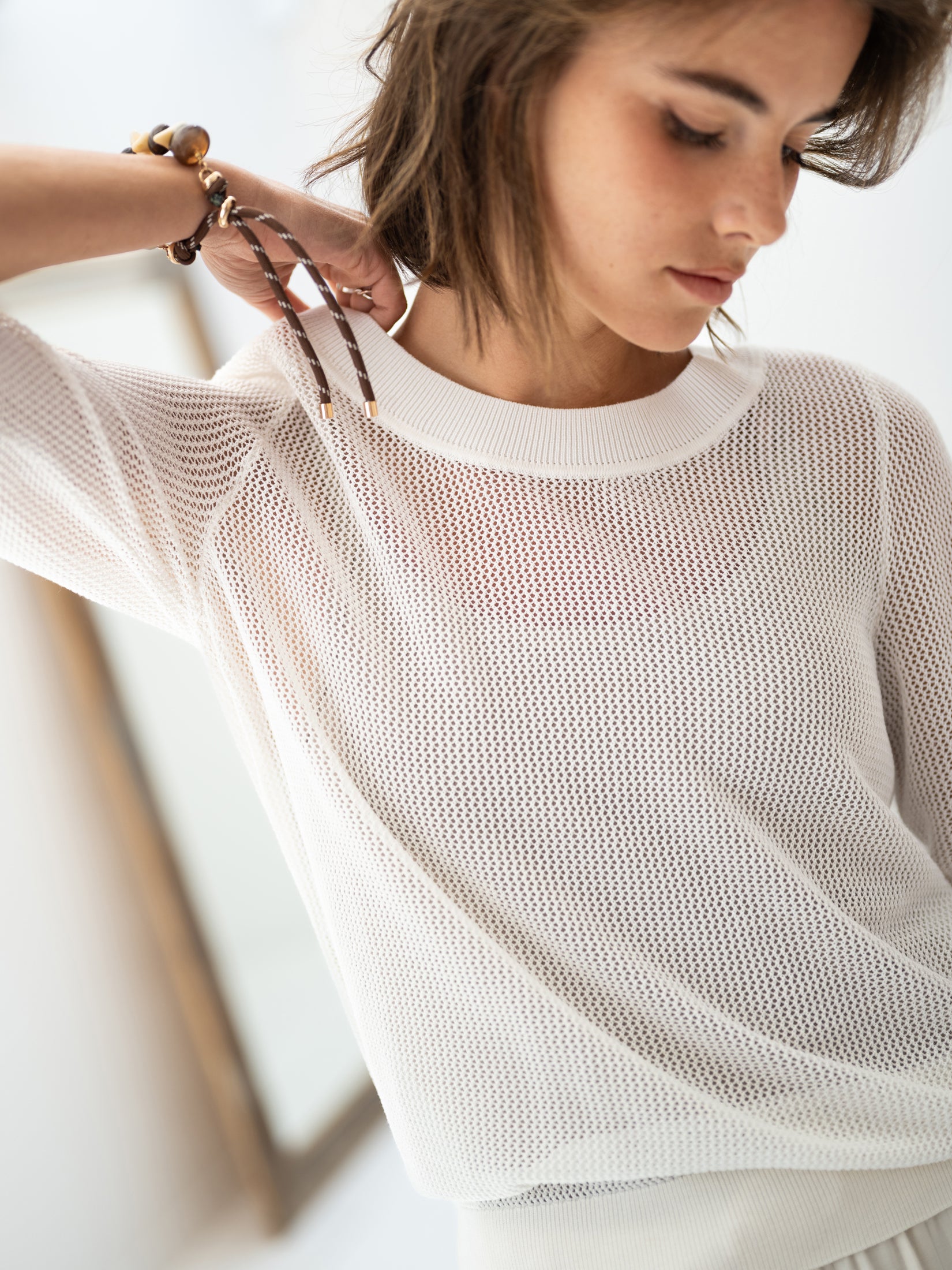 Sheer white mesh sweater with silk by PLEIN PUBLIQUE, product shown from the front.