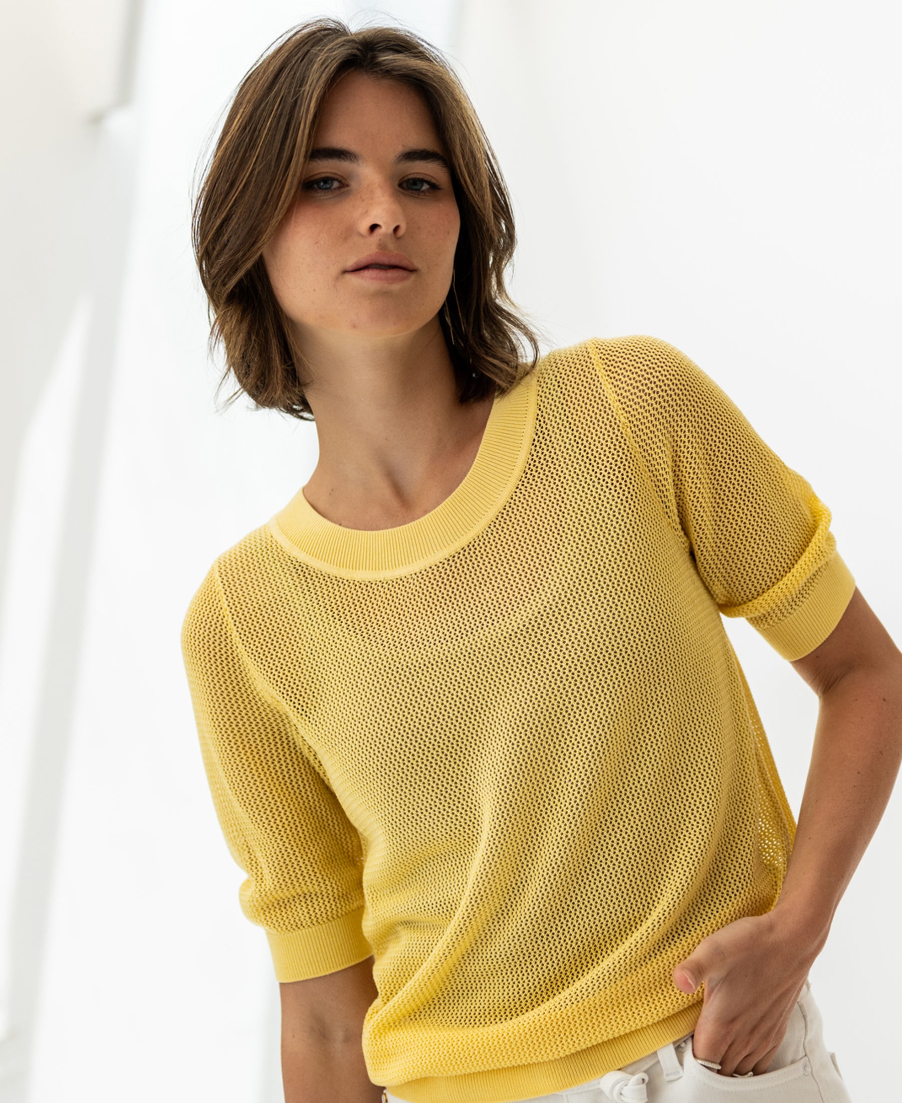 Citron yellow mesh sweater with silk, shown on white background.