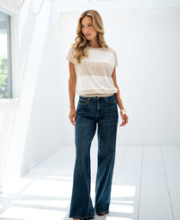 Striped sweater LA PALOISE by PLEIN PUBLIQUE shown in a bright room, side view.