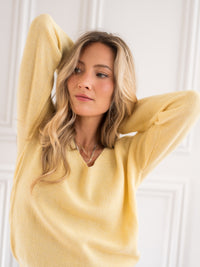Yellow Merino wool sweater by PLEIN PUBLIQUE, shown on a white background.