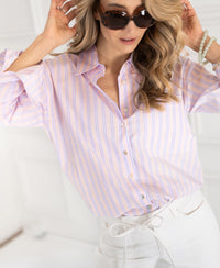 Woman wearing Plein Publique LA Pascalle multicolor striped blouse indoors.