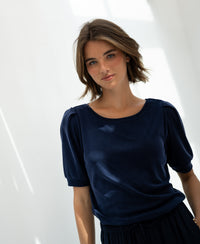 Navy ribbed T-shirt in bright natural light.