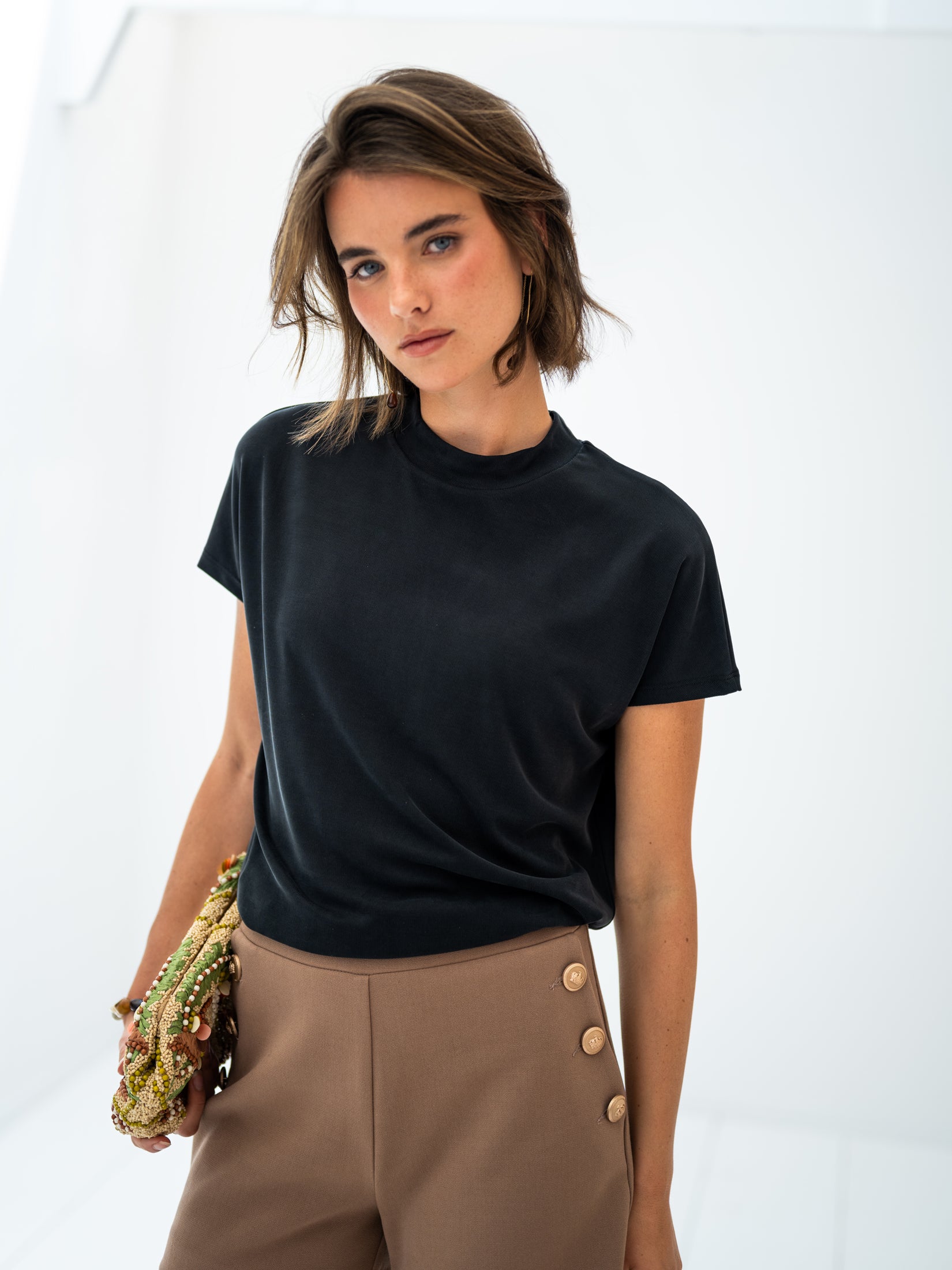 Camel-gold buttoned shorts by PLEIN PUBLIQUE against a white background.