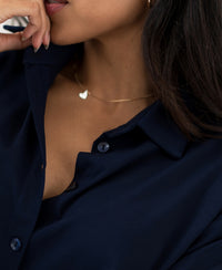 Front view of the LE RAPHAEL dark blue button-down dress with kimono sleeves by PLEIN PUBLIQUE.