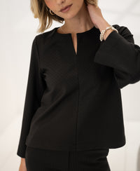 PLEIN PUBLIQUE pinstripe top Le Saint in pure chocolate color with 7/8 sleeves, shown in a bright room.