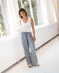 Striped linen-blend pants in jeans blue from Plein Publique, style La Seconde, shown indoors.