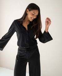 PLEIN PUBLIQUE Travel Pants LA JULIA Black shown against a light background.