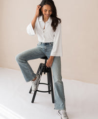 White LA SILVESE travel blouse by PLEIN PUBLIQUE shown on model.